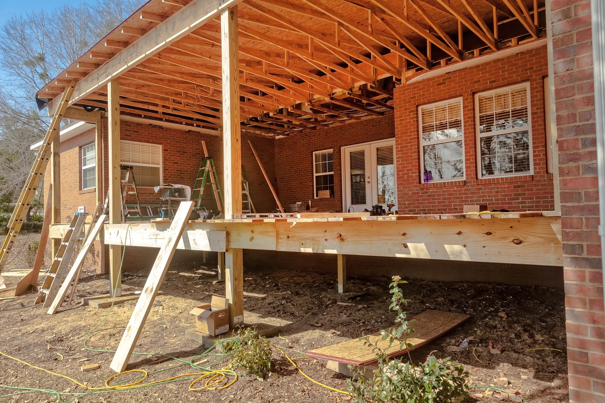 Screen porch with comfortable seating and view of the garden